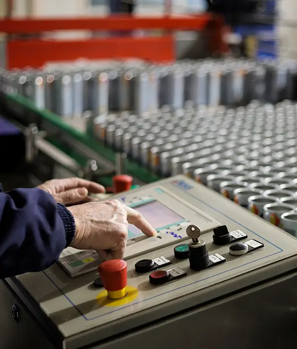 Detailed shot of Bisous cans during packaging preparation